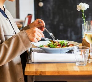 person eating vegetable salad